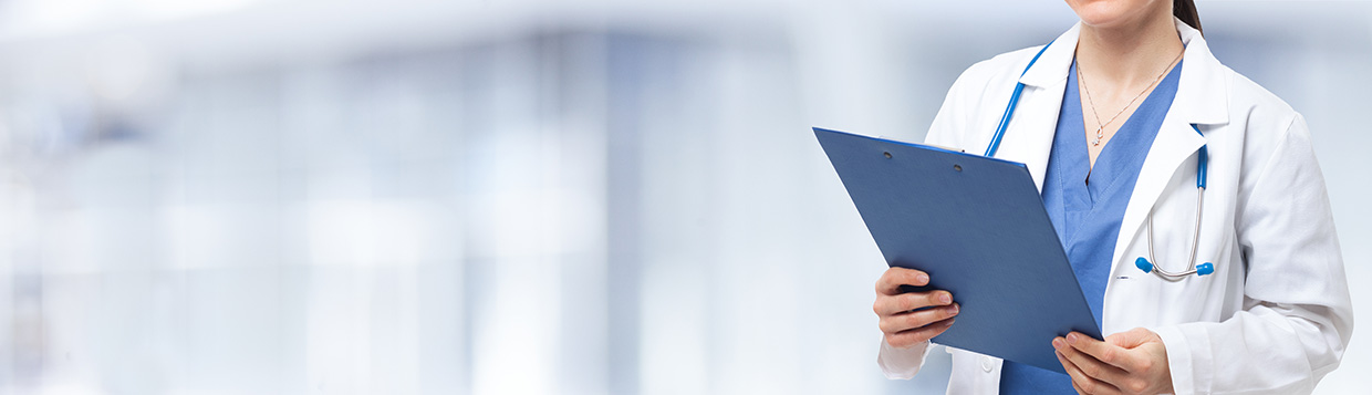 Detail of a nurse holding a clipboard